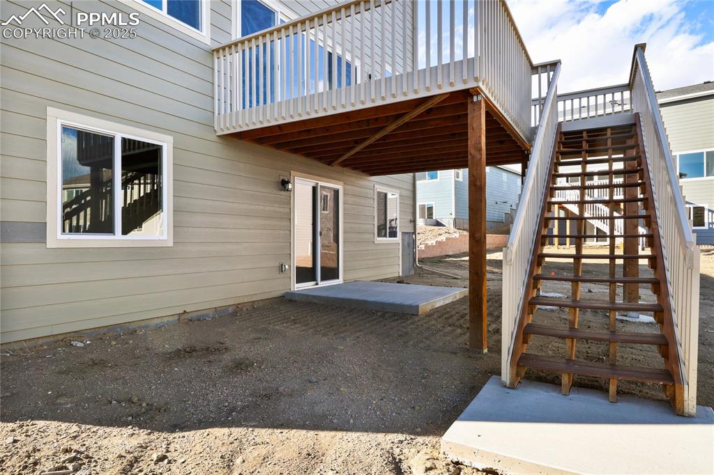 Image 5 of 38: View of patio / terrace featuring a deck and stairway