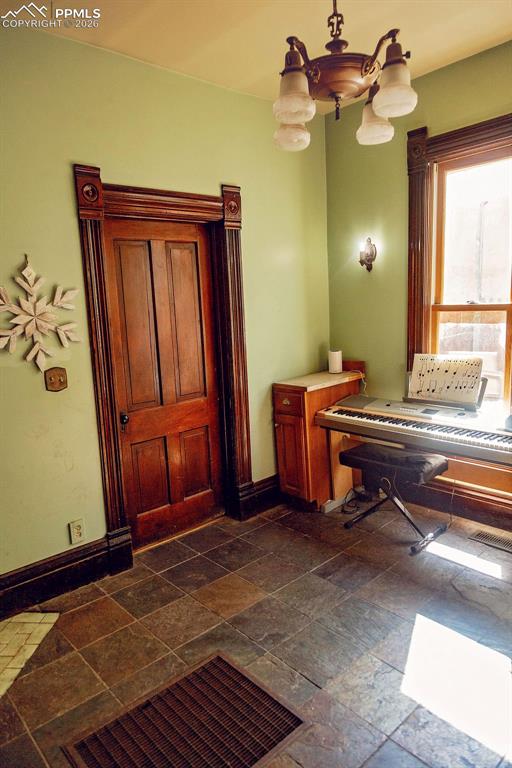 Image 14 of 38: Sitting Room off Entry (with Door to Entry Area)