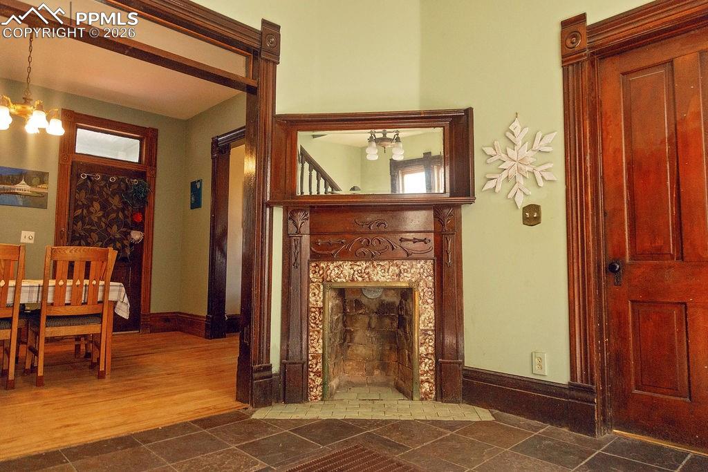 Image 15 of 38: Sitting Room with Fireplace (Looking Towards Dining Room)