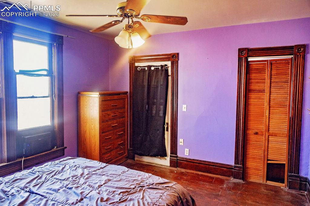 Image 28 of 38: Primary Bedroom with Walk-In Closet & Covered Walk-Out Patio