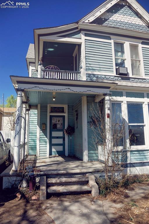 Image 3 of 38: Covered Front Porch & Covered Primary Bedroom Walk-Out Porch
