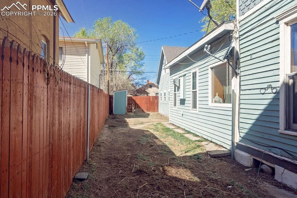 Image 36 of 38: South Side of Backyard (Looking Towards Shed & Garage)