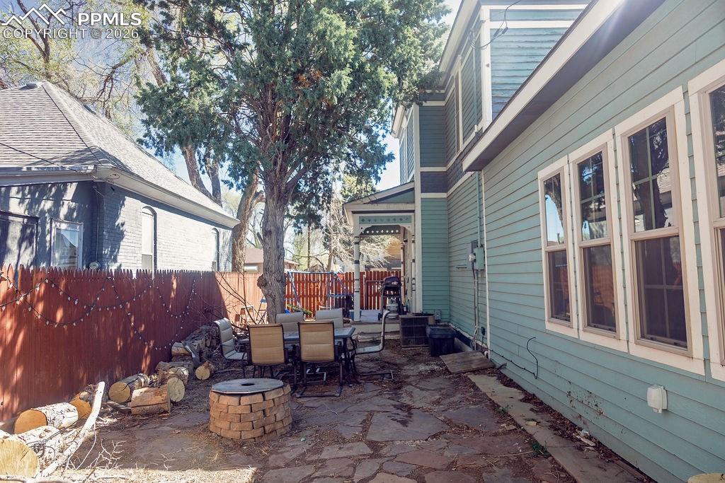 Image 37 of 38: North Side of Backyard (Looking Toward Front Yard & Walk-Out from Dining Ro