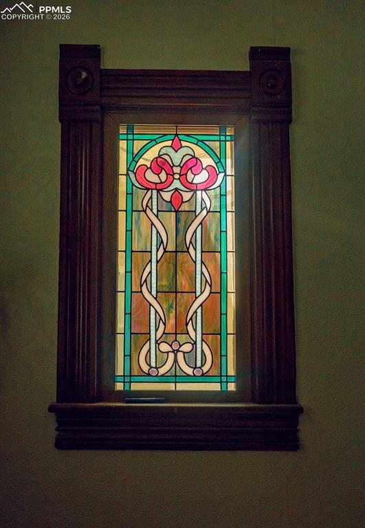 Image 5 of 38: Entry Area with Beautiful Stained Glass Window
