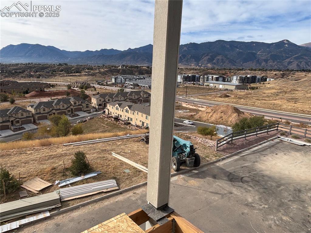 Image 10 of 16: View of mountain background with nearby suburban area
