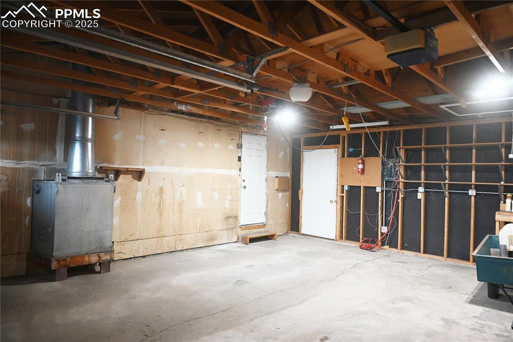 Image 14 of 17: Garage with a garage door opener