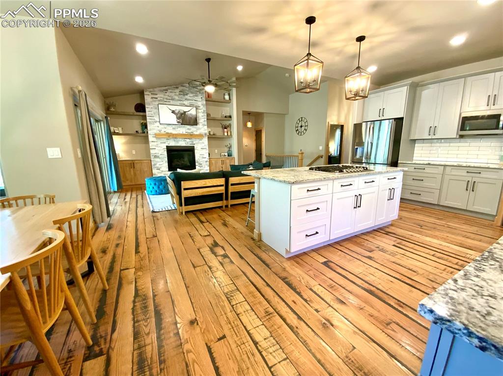 Image 12 of 47: Eat in kitchen, open floor plan