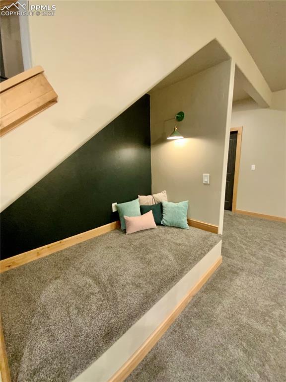 Image 27 of 47: Reading nook under the stairs 