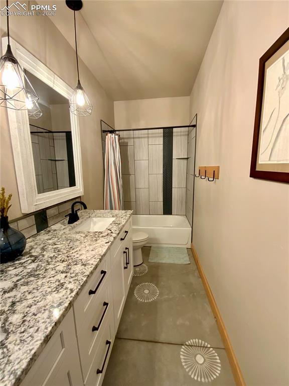 Image 36 of 47: Bathroom with vanity and shower / bathtub combination