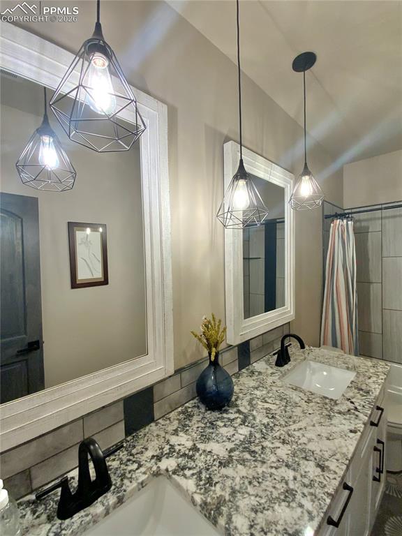 Image 37 of 47: Bathroom featuring double vanity