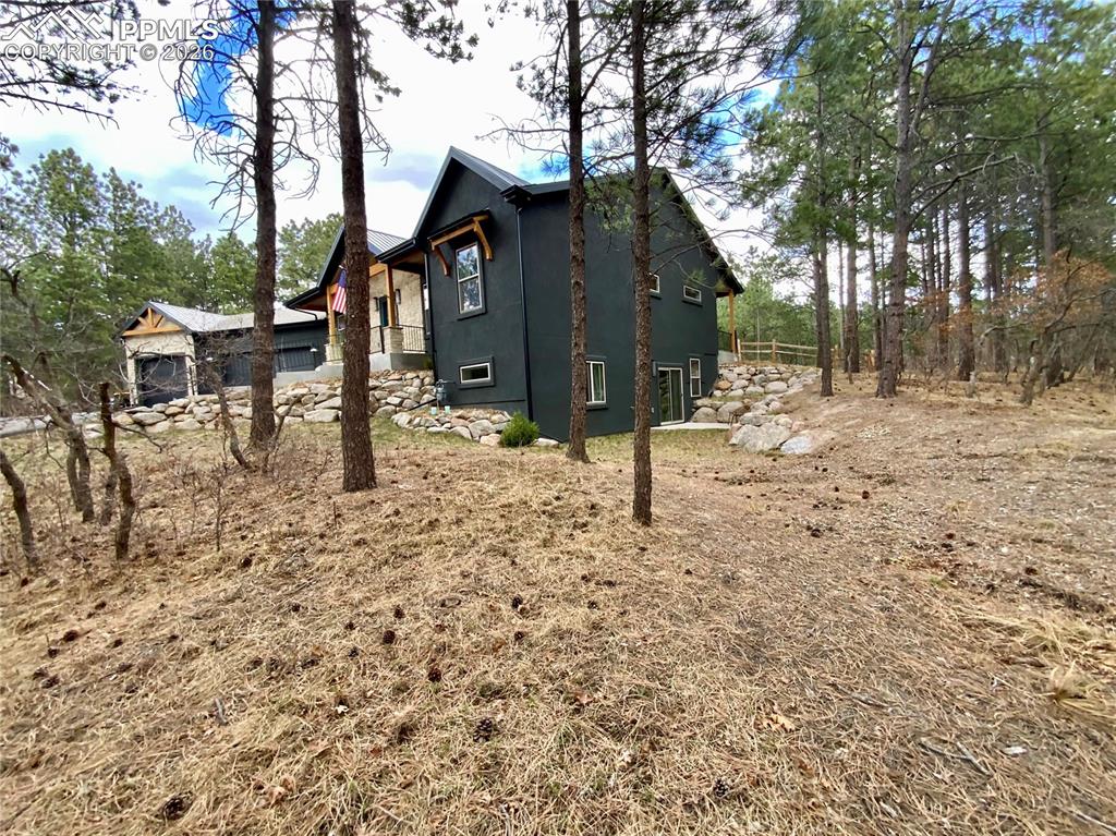 Image 45 of 47: View of property exterior and basement walkout 