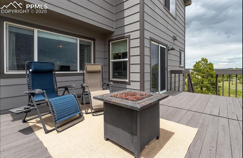 Image 16 of 44: Deck featuring a fire pit