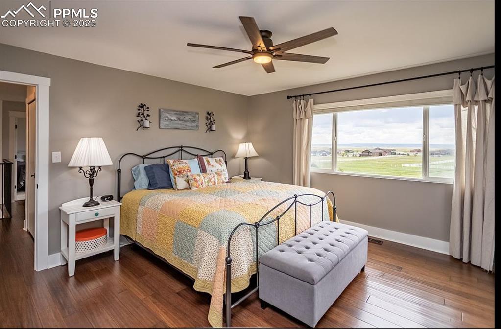 Image 18 of 44: Bedroom featuring dark wood-style flooring and a ceiling fan