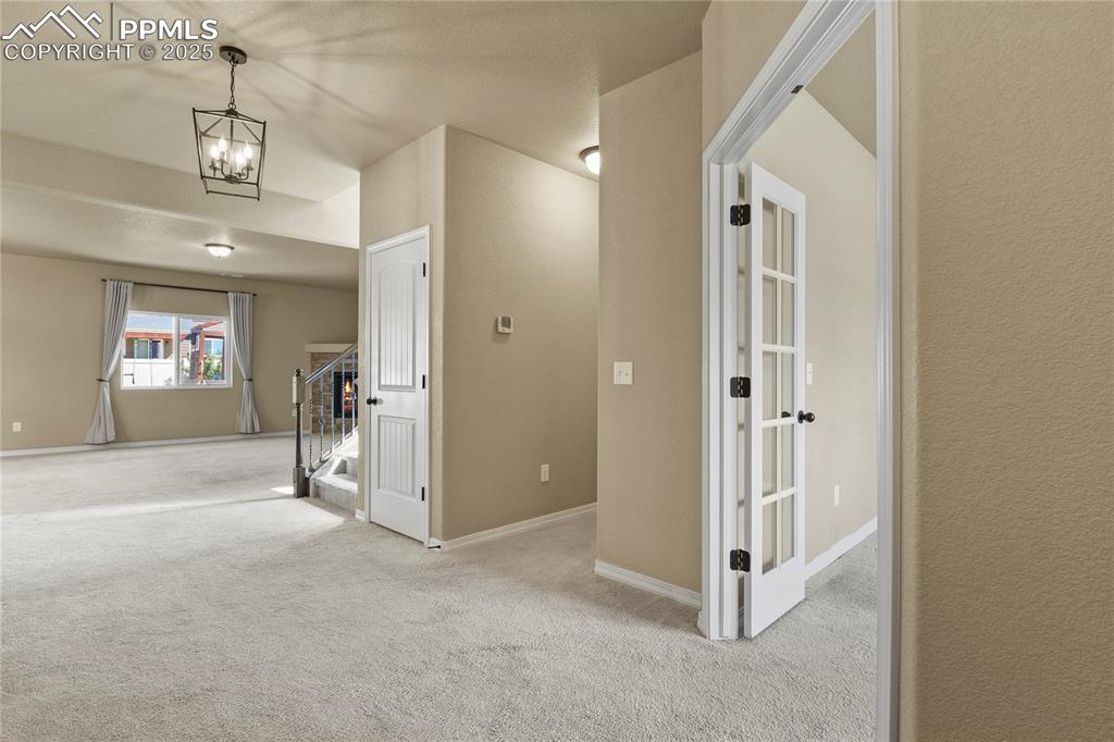 Image 4 of 39: As you walk in. Wide entry and office on right