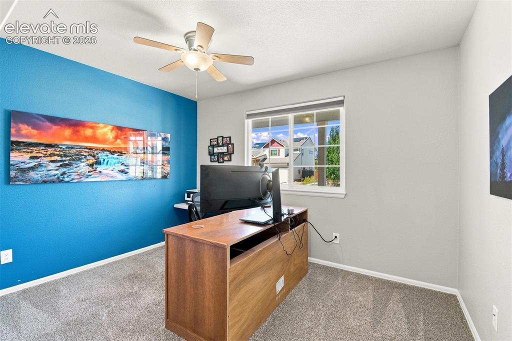 Image 17 of 32: Recessed lighting, ceiling fan, window with exterior views, and carpeted fl