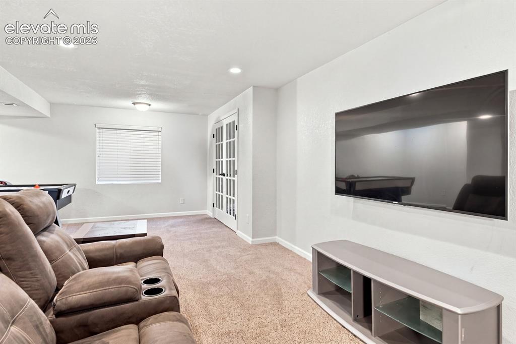 Image 24 of 32: Recessed lighting, ceiling-mounted light fixture, window with blinds, and F