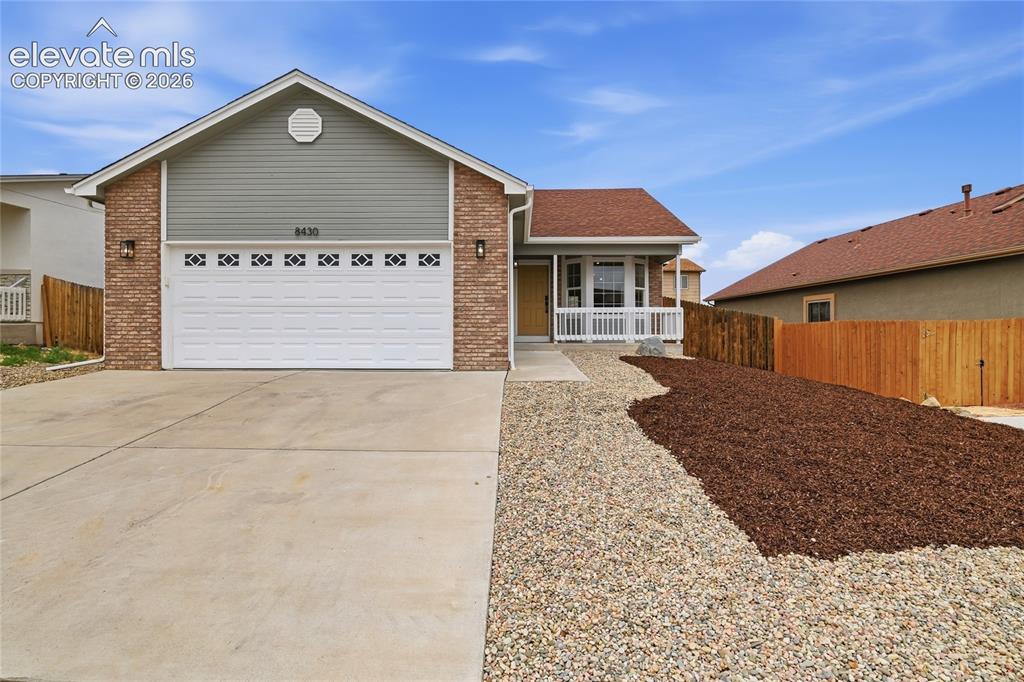 Image 1 of 30: Exterior featuring brick and horizontal siding accents, an attached garage