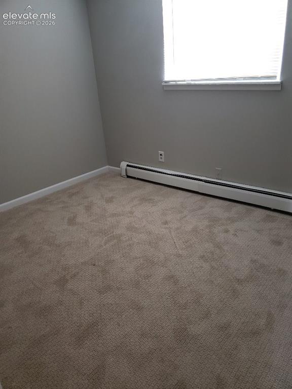 Image 4 of 23: Room featuring light gray painted walls, a window with horizontal blinds, a