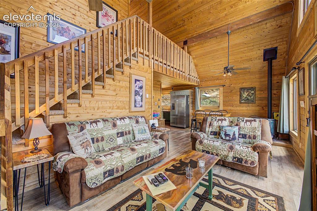 Image 18 of 50: Cozy log cabin feel and gas fireplace