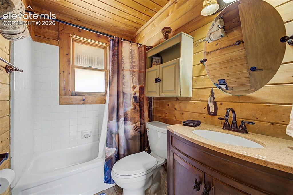 Image 34 of 50: Main floor bathrooms
