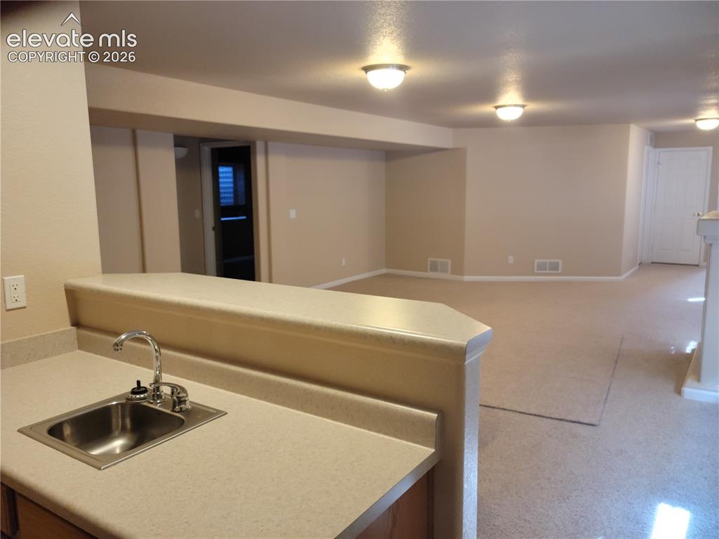 Image 8 of 11: wet bar and rec room
