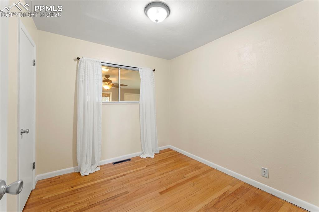Image 31 of 41: Spare room featuring baseboards and light wood-style floors