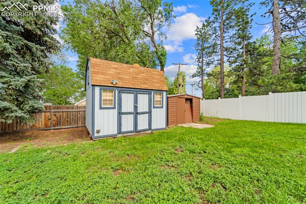 Image 34 of 41: View of shed featuring a fenced backyard