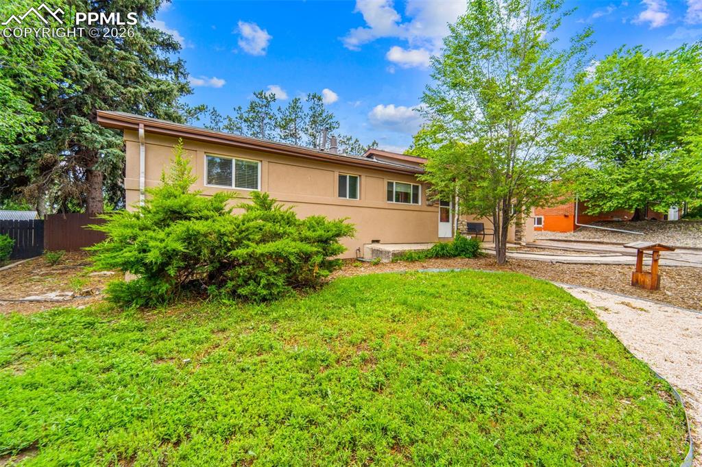 Image 4 of 41: Rear view of house featuring stucco siding