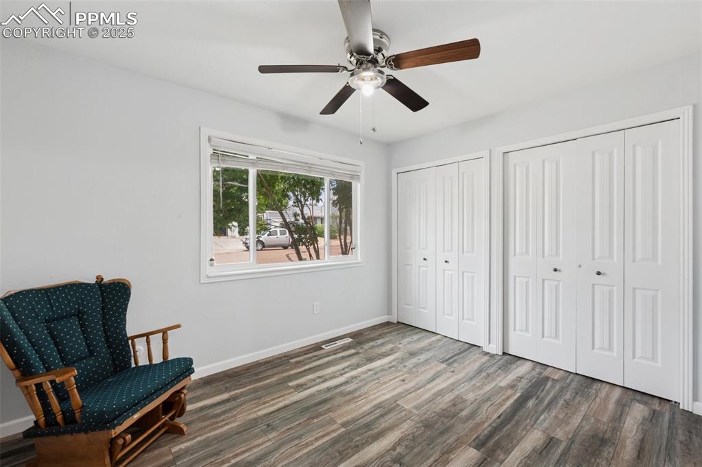 Image 15 of 31: Bedroom #2, featuring a ceiling fan with light, laminate flooring, and clos