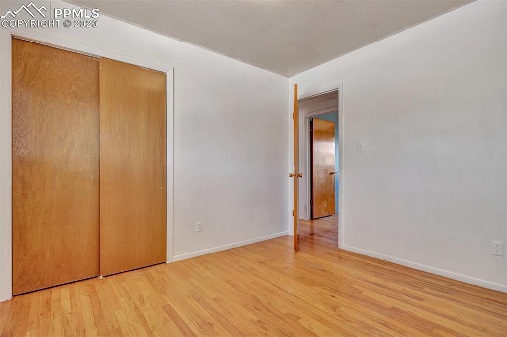 Image 19 of 36: Hardwood flooring extending throughout the space