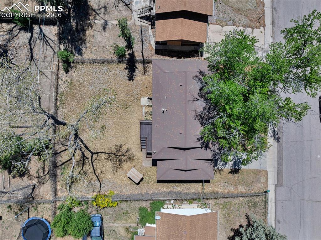 Image 33 of 36: Brown shingle roof structure with multiple gables