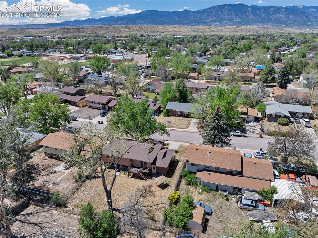 Image 34 of 36: Residential neighborhood featuring single-family homes with pitched roofs a