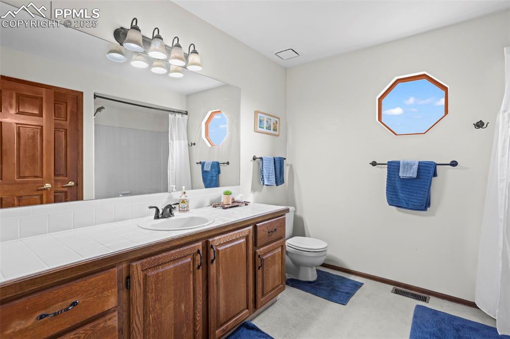 Image 17 of 36: Upstairs full bath