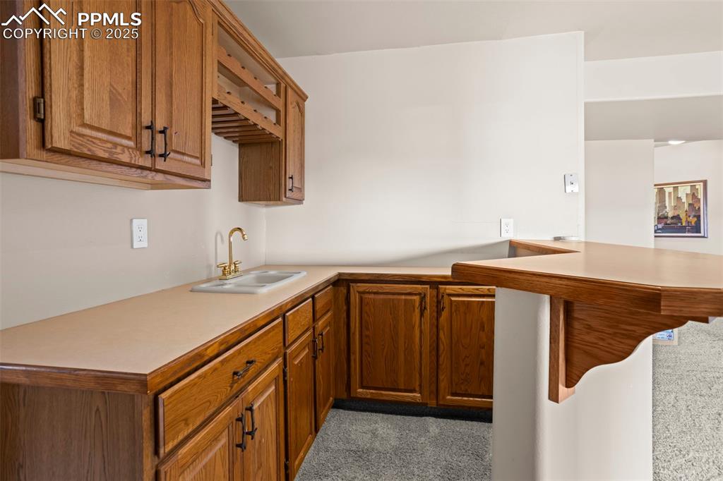 Image 22 of 36: Basement wet bar
