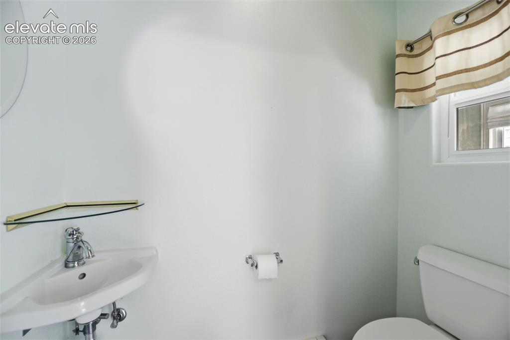 Image 21 of 45: Main-level half bath