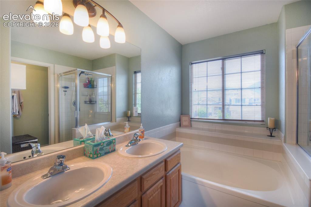 Image 23 of 35: Double sinks and a soaking tub to relax in at the end of the day!
