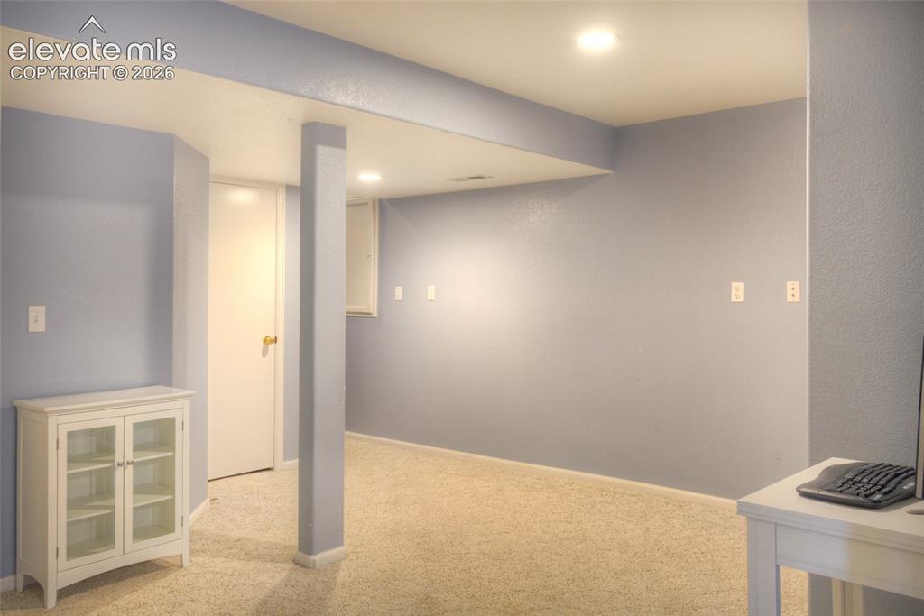 Image 29 of 35: Basement bedroom perfect for a mother in law suite.