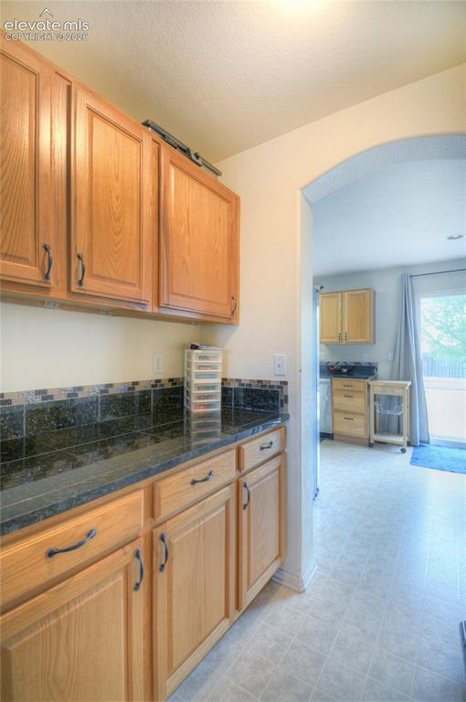 Image 9 of 35: One of 2 family rooms! Main level family room has a gas fireplace, built in