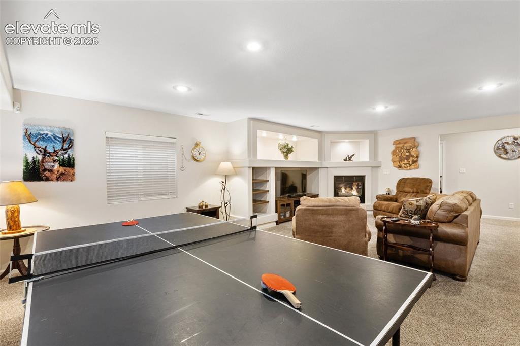Image 31 of 50: Game area on the side of the family room