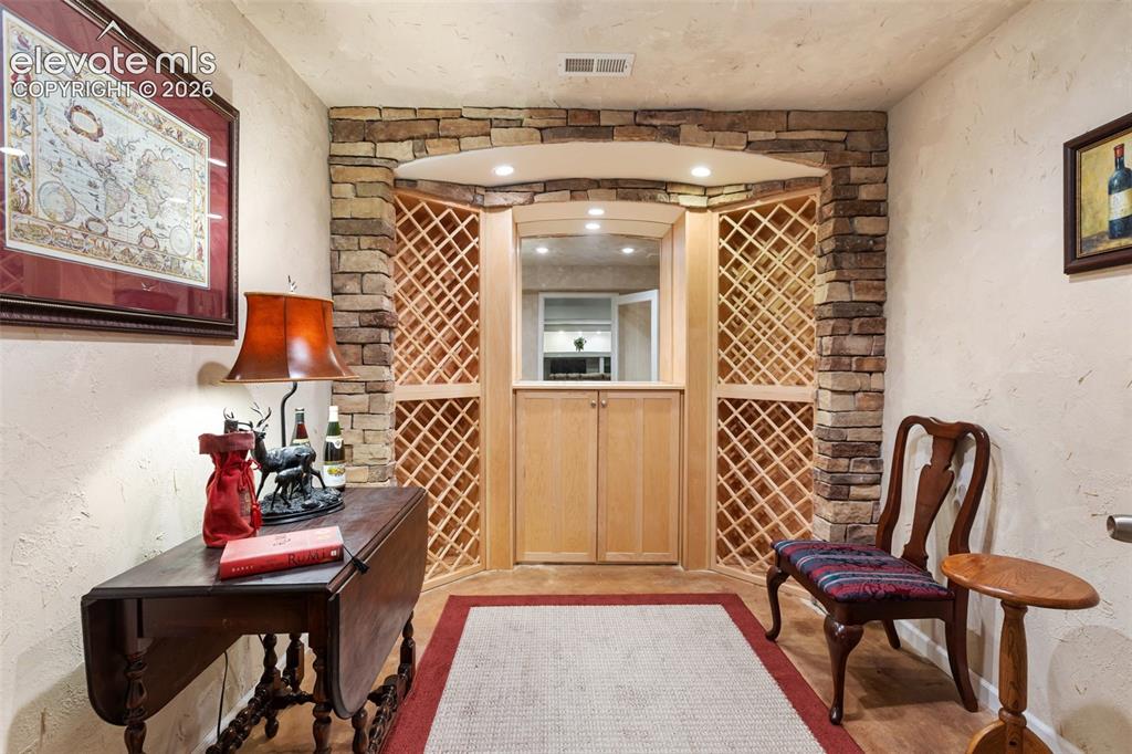 Image 33 of 50: Wine cellar & tasting room in basement