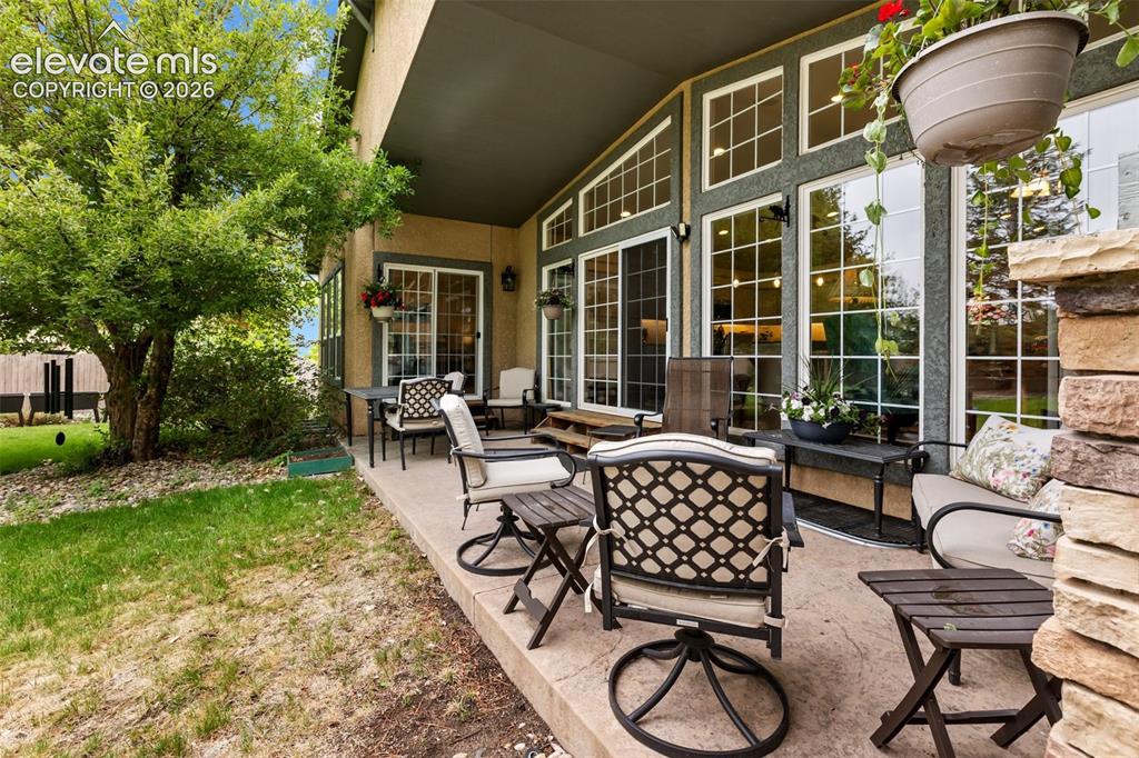 Image 40 of 50: Covered back yard patio