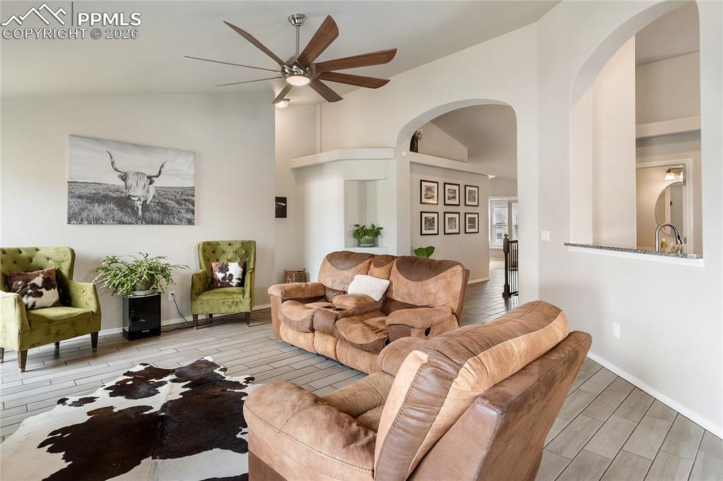 Image 17 of 41: Living area with vaulted ceilings