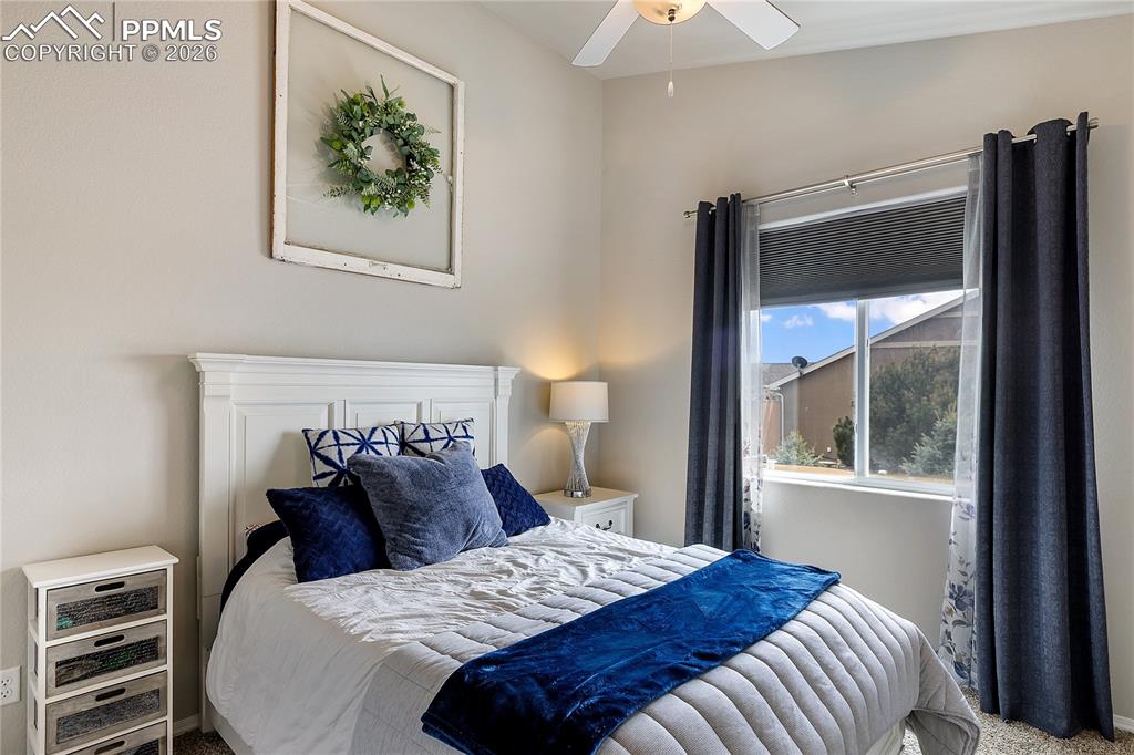 Image 23 of 41: Bright secondary bedroom with an en suite bathroom
