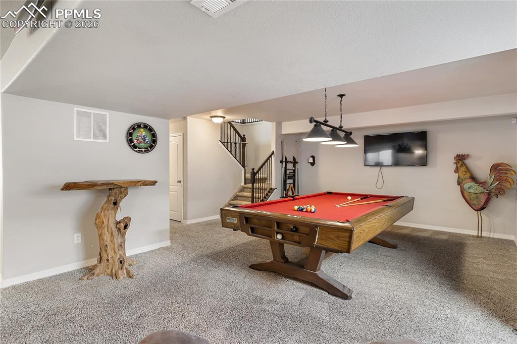 Image 25 of 41: Large basement rec room with versatile living space.
