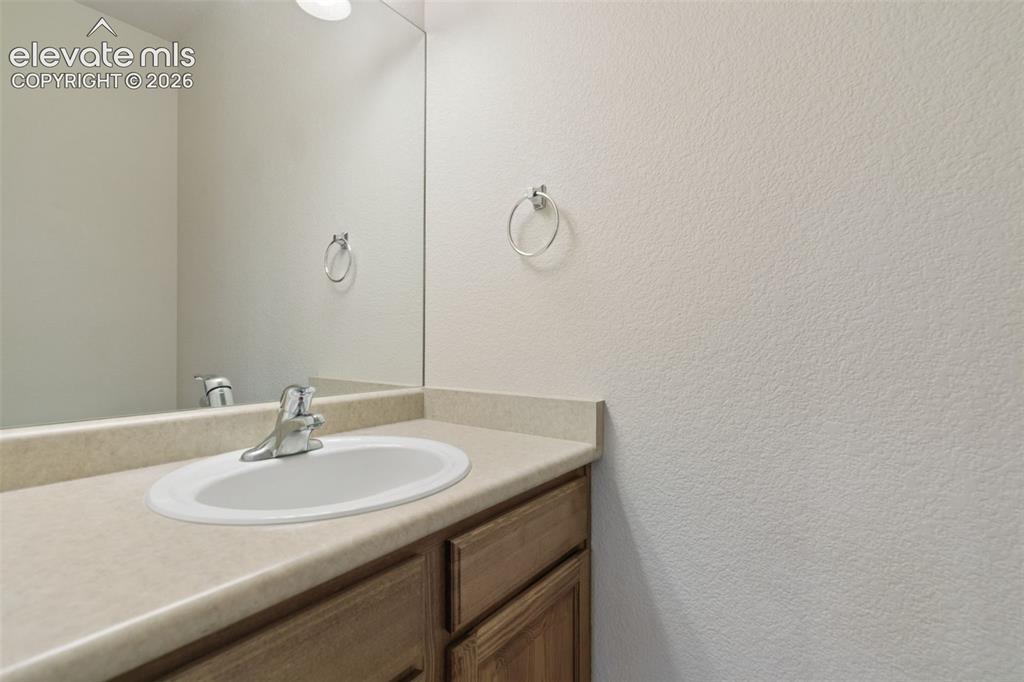 Image 15 of 34: Main-level powder room