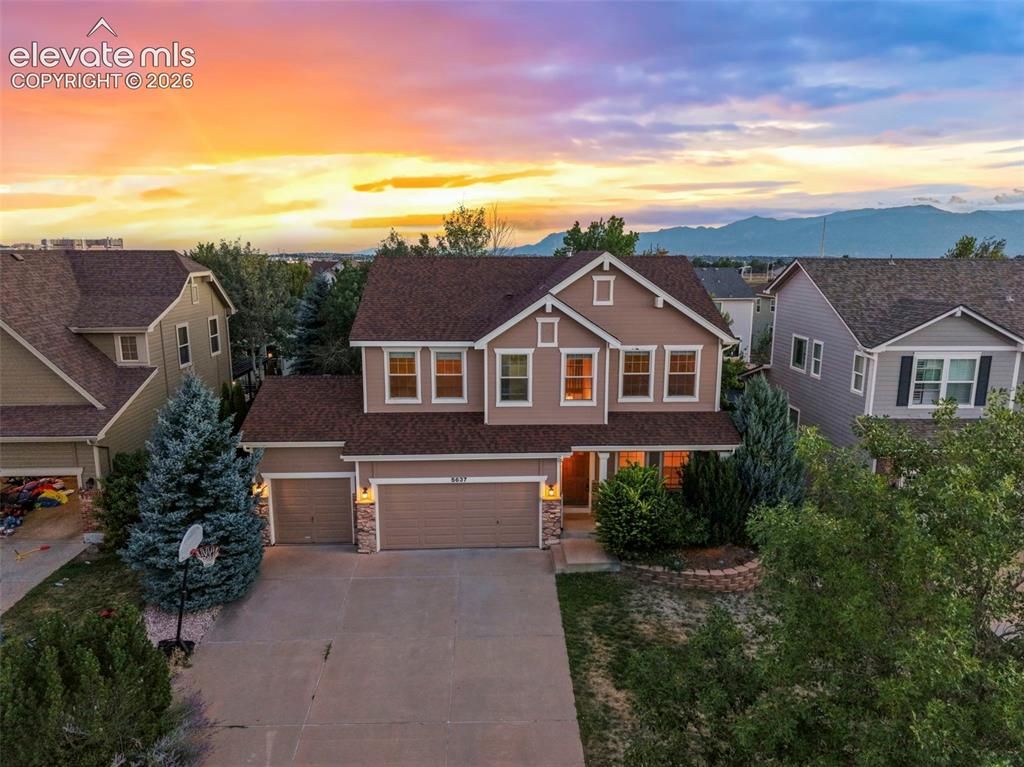 Image 2 of 34: Front of home at dusk