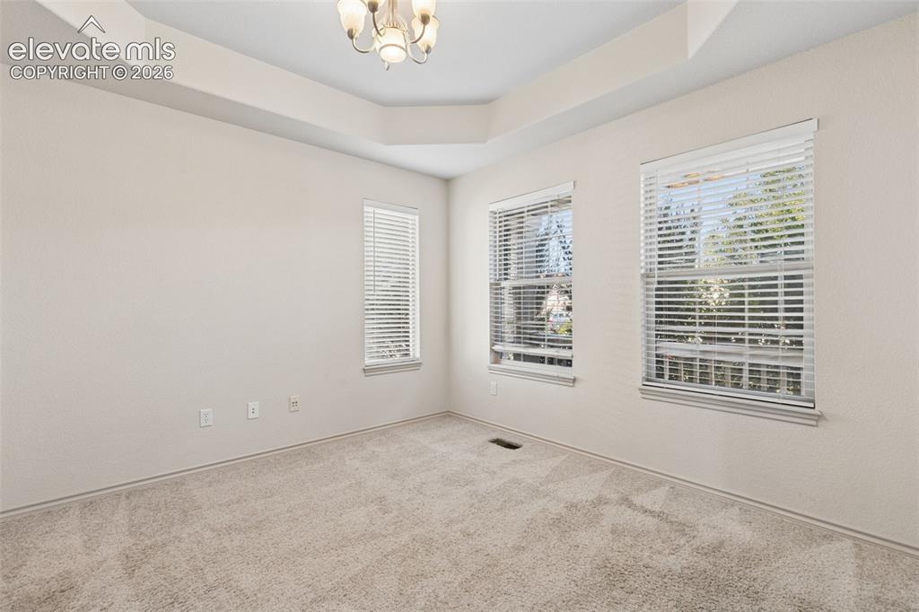 Image 6 of 34: French doors flank the front office, perfect for a workspace or studio