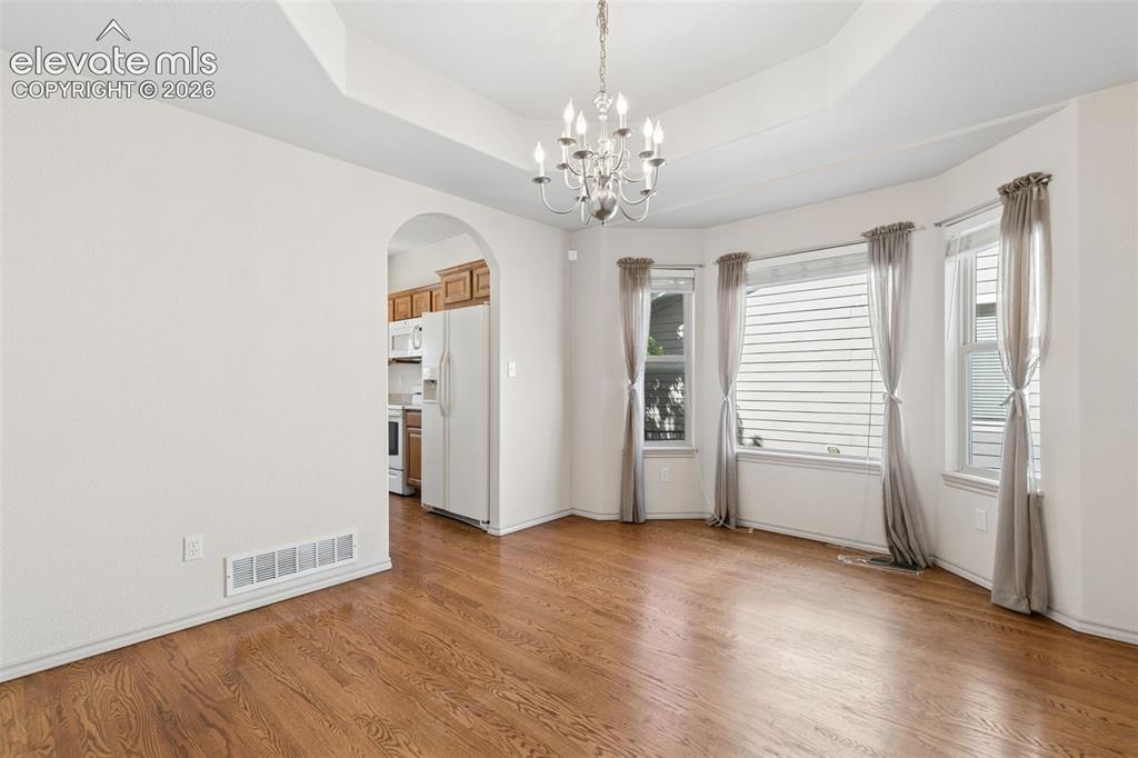 Image 7 of 34: Entertaining is a breeze in the formal dining room featuring a bay window, 