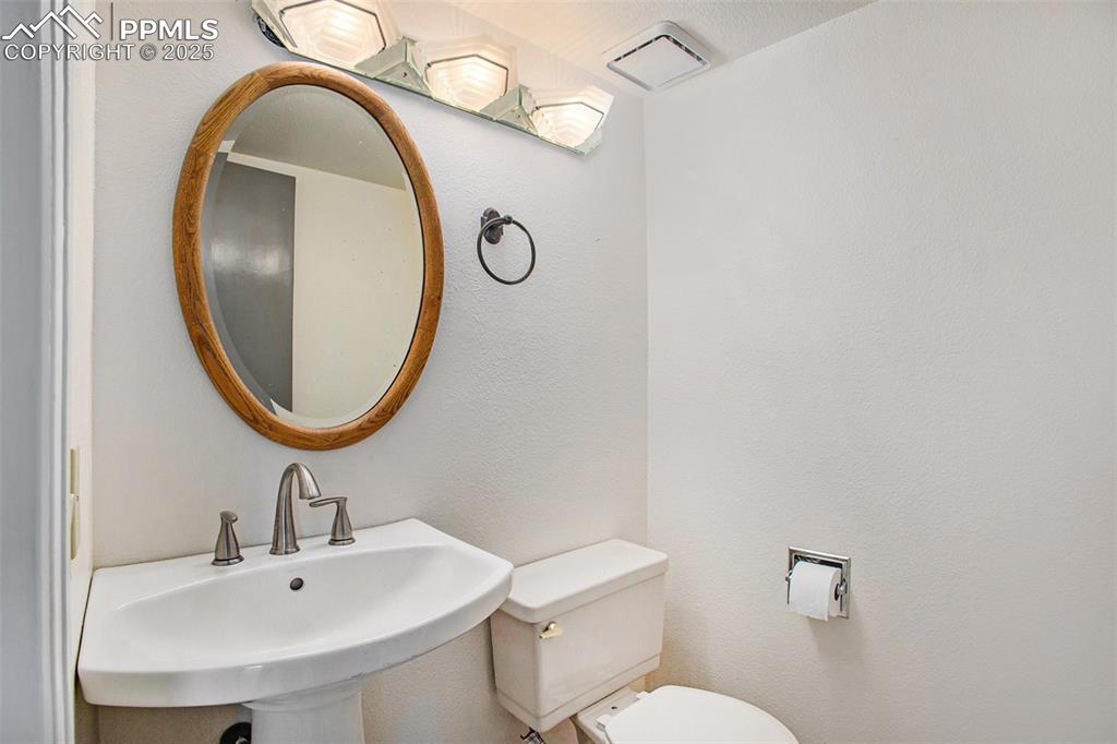 Image 8 of 20: Main floor half bath for guests 
