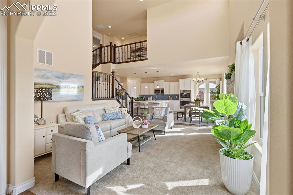 Image 2 of 45: View Towards Kitchen And Loft Space On second floor, Shows Ceiling Height, 